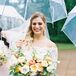Bride Underneath Clear Umbrella During Daytime Wedding