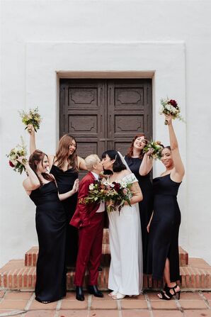 Brides in Different, Alternative Wedding Outfits Kissing Surrounded by Bridesmaids in Black Dresses