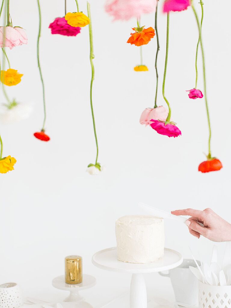Hanging flower backdrop idea from Sugar & Cloth