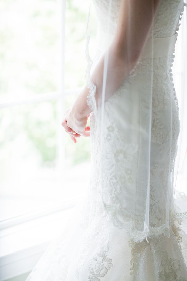 Bride In Veil Standing Near Window