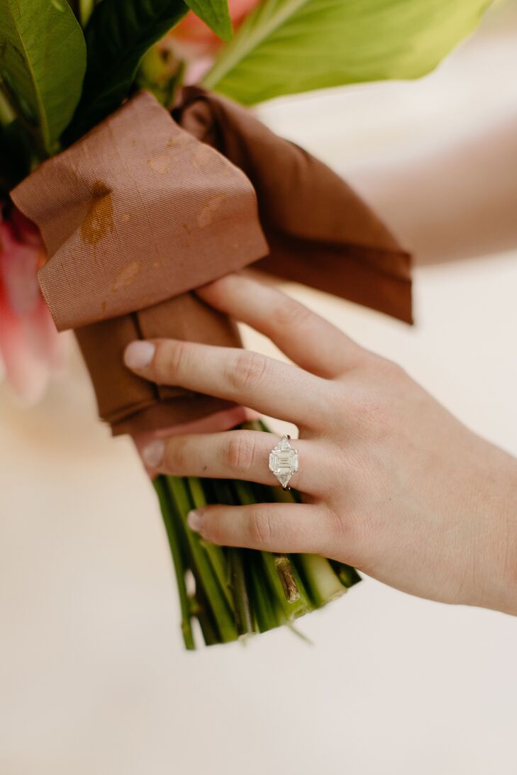 Hand With Emerald-Cut Engagement Ring