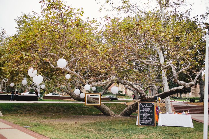 “We hung a large frame by fishing wire from two trees and set it up as a photo booth,” says the couple.
