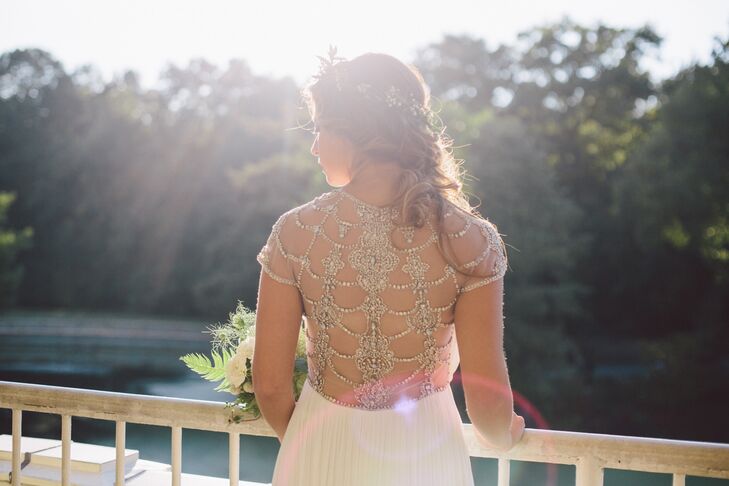 Dana wore the Tallulah wedding dress by BHLDN, a long, flowy gown with a silk tulle skirt and crystal details on the cap sleeves and back. “When I saw how stunning the back was, I knew it was my dress!”