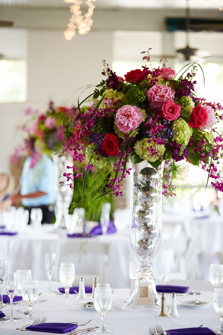 With deep purples in mind, the couple's florist from A Floral Affair transformed the reception space with towering centerpieces made of roses and hydrangeas.