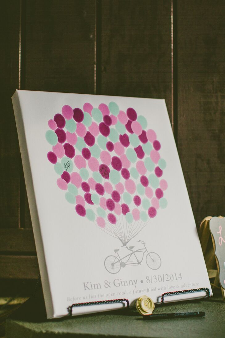 The bicycle was a major motif throughout the day, so it was fitting that the guest book would feature a tandem bike attached to a colorful array of balloons for guests to sign.