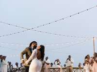 The happy couple dancing at their outdoor wedding reception.