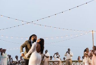 The happy couple dancing at their outdoor wedding reception.