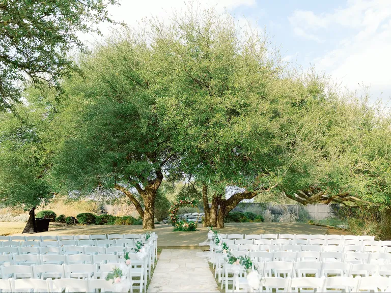 Outdoor ceremony space with large trees at Bella Oaks wedding venue in Austin, Texas