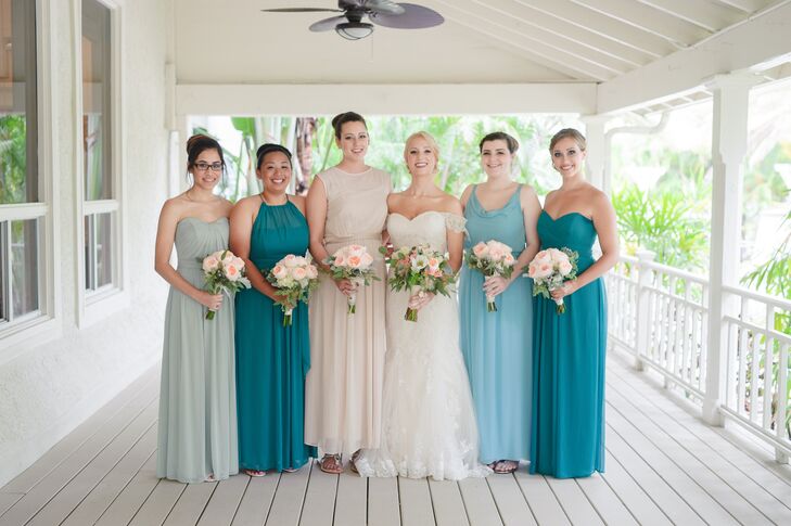 The bridesmaids wore floor-length dresses in different styles from AfterSix.com. Erica’s Maid of Honor stood out among the green hues with a champagne colored dress.  All paired their outfit with an updo hairstyle, wedge shoes and simple jewelry.