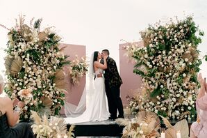 First Kiss During Beach Wedding at Nizuc Resort and Spa in Mexico