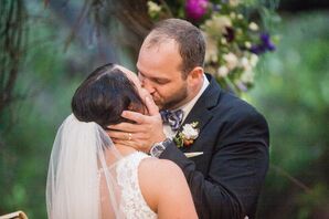 Bride and Groom Kiss in Rain at Camp Lucy Ceremony