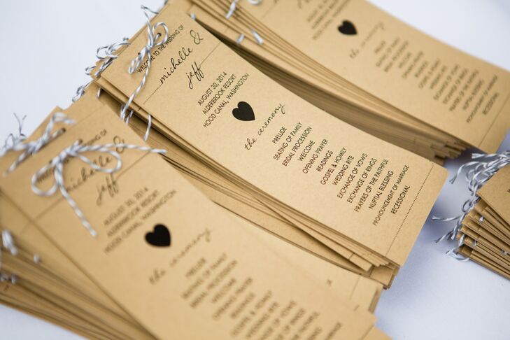 When guests entered the ceremony space, they each grabbed a thin kraft-paper program with heart-shaped designs decorating the front. Baker's twine tied in bows topped each wedding program.