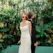 Bride and Groom Back-to-Back in Industrial Garden Space for a "No-Look First Look"