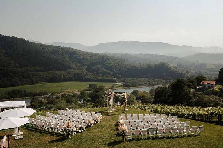 Outdoor wedding ceremony overlooking hillside