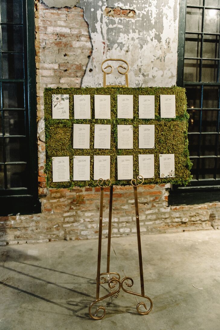 Guests found their seats on cream-colored felt paper pinned to the moss-covered board. The display went along with the rustic style of Mount Washington Mill Dye House in Baltimore, Maryland.
