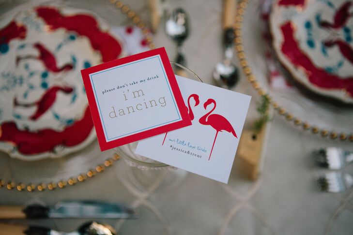 Colorful cards held guests' drinks as well as listing the official hashtag for social media photos of the wedding.