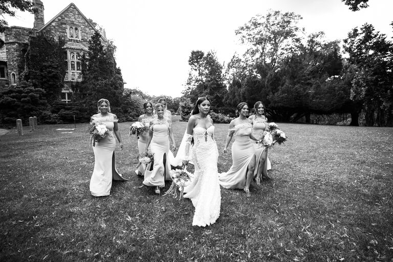 nurys Marcel wedding influencer bridesmaids on field in castle wedding