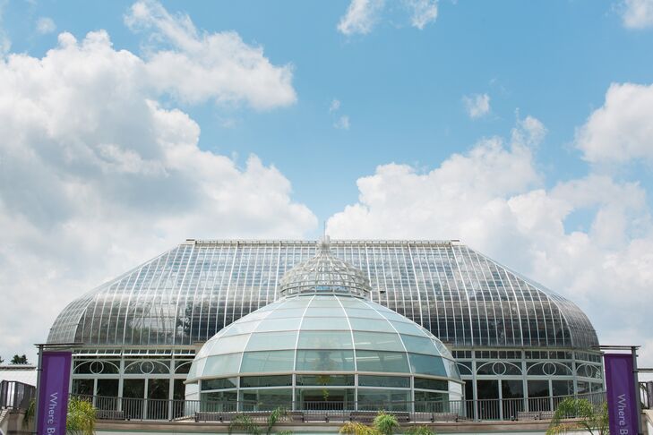 Brianna loved the idea of having a romantic English garden-inspired theme for their wedding. So she and Eric held the ceremony at Phipps Conservatory and Botanical Gardens in Pittsburgh, Pennsylvania. The natural space served as the perfect backdrop for photos.