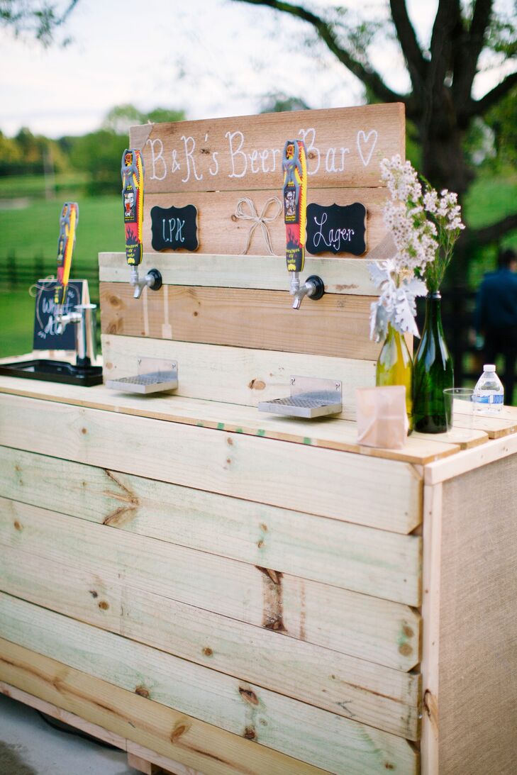 Ryan's father actually made this beer bar for cocktail hour using wood pallets to conceal the refrigerators below. There were three different types of beer -- all sourced from nearby Apocalypse Brewery in Lynchburg, Virginia. Mini chalkboard signs listed the beers on tap.