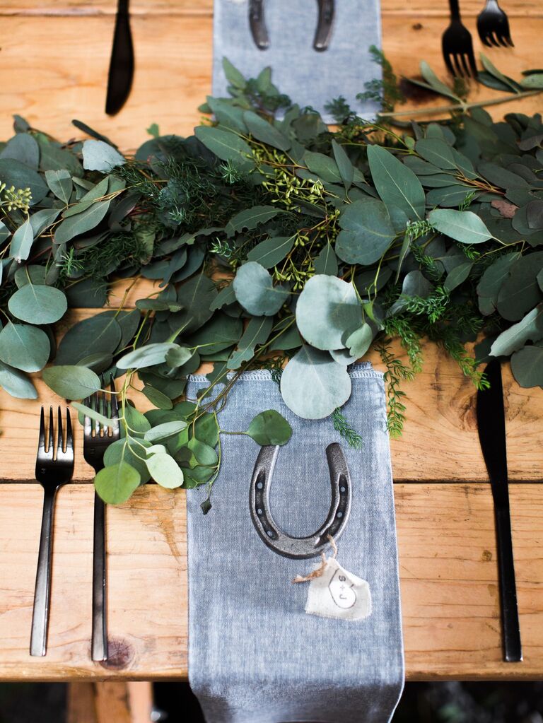 Rustic horseshoe wedding favor set on the reception dining table. 