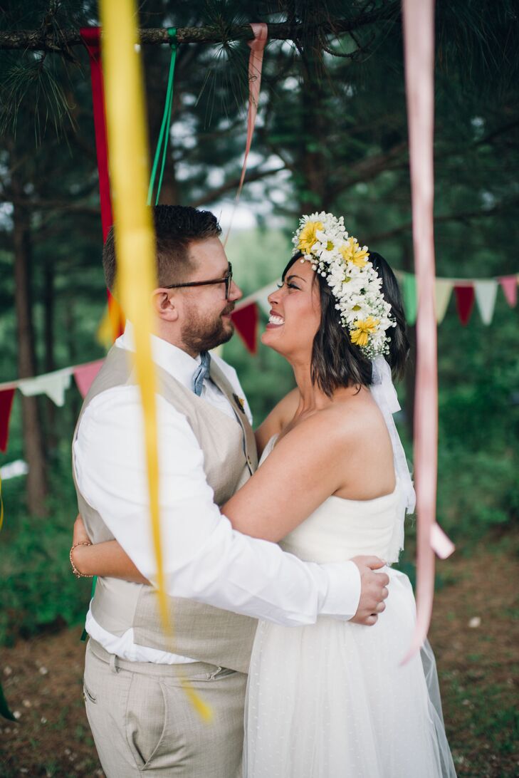 Namia wore a yellow and white daisy and baby's breath flower crown to tie in the boho, woodland wedding theme.