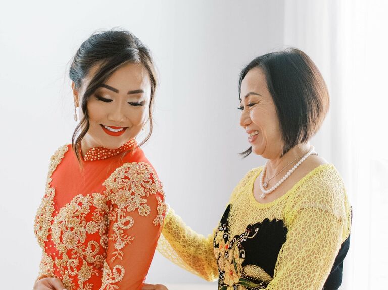 Mother of the bride wears her hair in a sleek bob. 