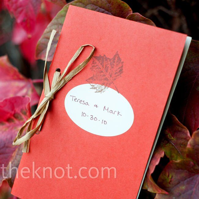These DIY programs were wrapped in a-colored card stock, stamped with a leaf design and tied together with raffia.