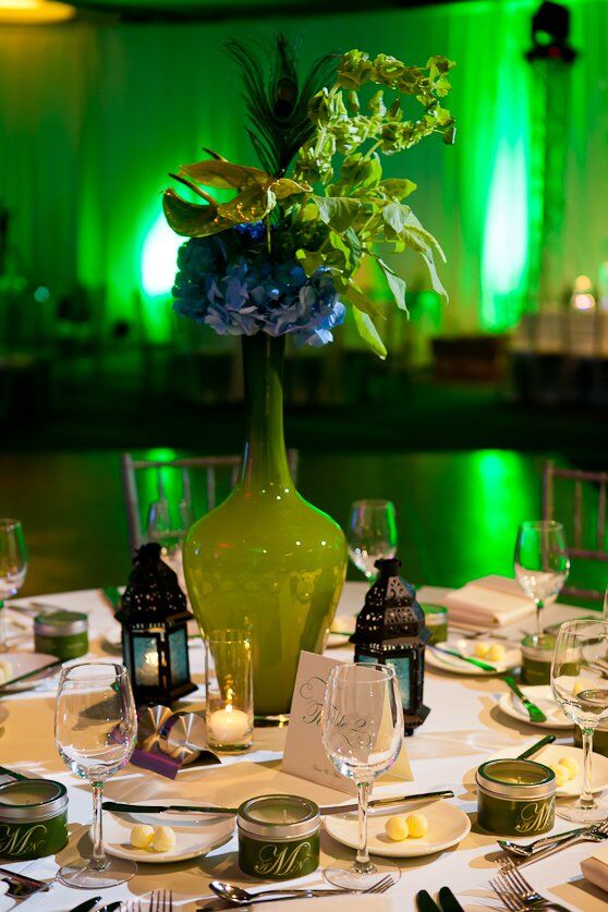 Moroccan lanterns and green bulb vases, filled with cobalt hydrangeas and green anthurium, gave the tables a dramatic look.