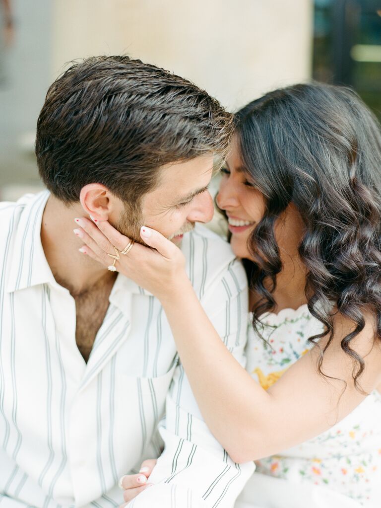 Engaged couple share a sweet moment. 