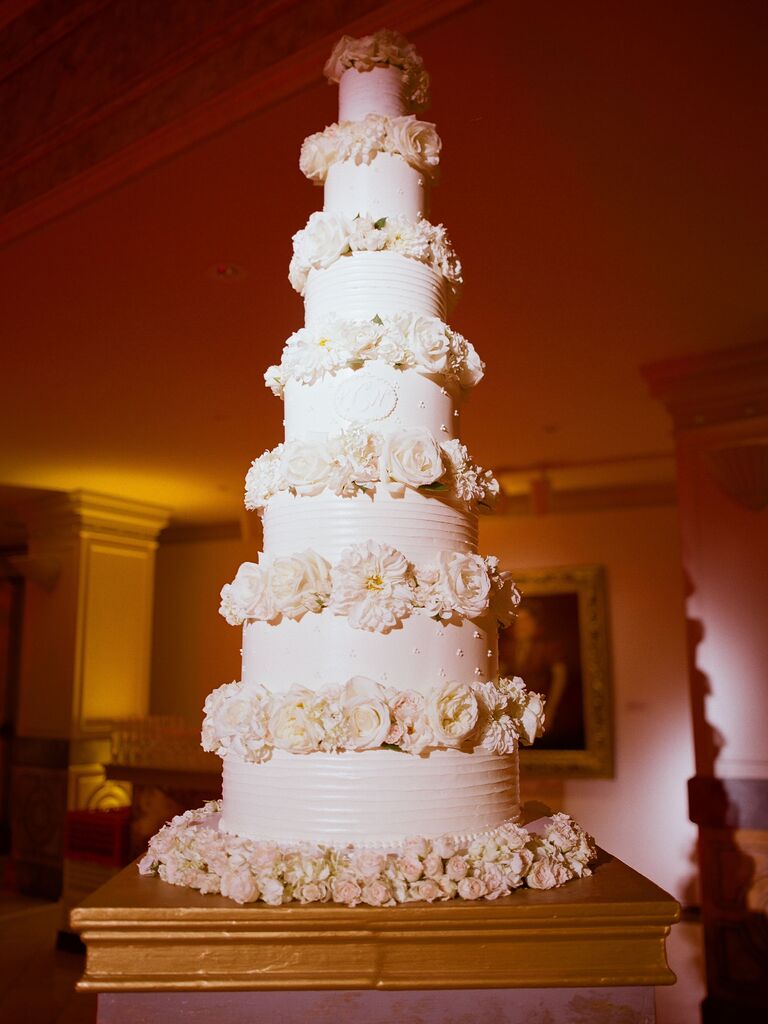 White seven-tier wedding cake with flowers