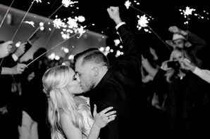 Bride and Groom Kissing During Classic Sparkler Exit