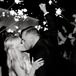 Bride and Groom Kissing During Classic Sparkler Exit