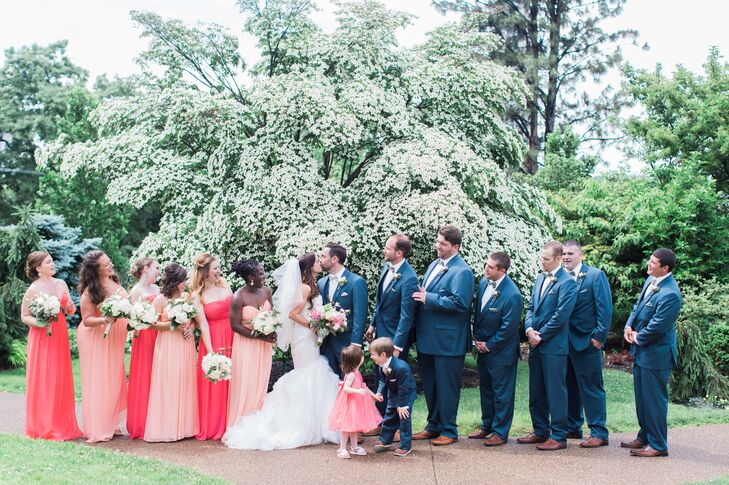 Each groomsmen was ready for the wedding in a blue tuxedo. They matched Eric with white shirts and brown shoes, but switched things up with blue bow ties instead of ivory. “I loved the look of blue suits instead of a black tux, and they really went well with the color palette,” Brianna says.