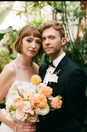 Bride With Pearl Headband and Short Hairstyle With Her Groom in Classic Black Tuxedo, Light Flowers