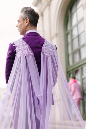 Groom in Purple Tuxedo and Custom, Cascading Cape in the Style of a Cathedral Veil