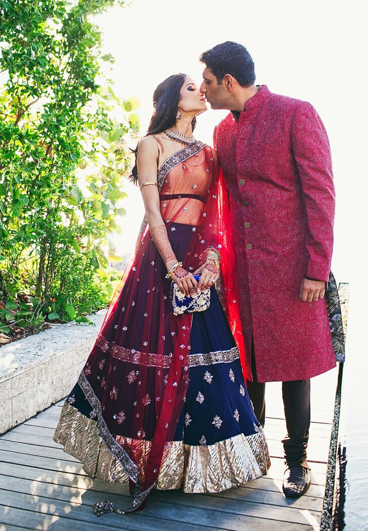 Melanie and Neeraj arrive for their sangeet, a festive party held the night before the wedding. The event began with a cocktail at sunset and ended with a massive dance party with all 250 guests. She wore a navy and gold lehenga while he donned a structured sherwani jacket with pants.