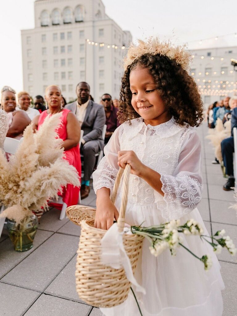 Flower girl throwing petals down the aisle.