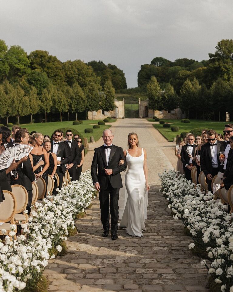 Hannah Godwin walking down the aisle at her wedding