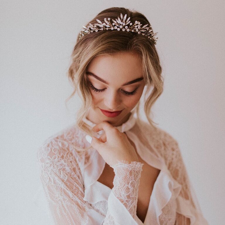 Model wears an art-deco inspired tiara. 