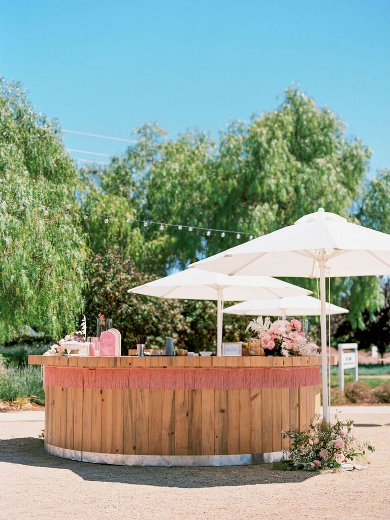 Wooden circular outdoor bar space for wedding receptions