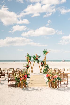 Beach Wedding Ceremony With Bamboo Folding Chairs and Dramatic Backdrop