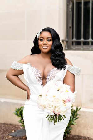 Bride in Fitted Gown, Crystal Headpiece Holding Structured, Light Bouquet of Cream-and-Blush Flowers