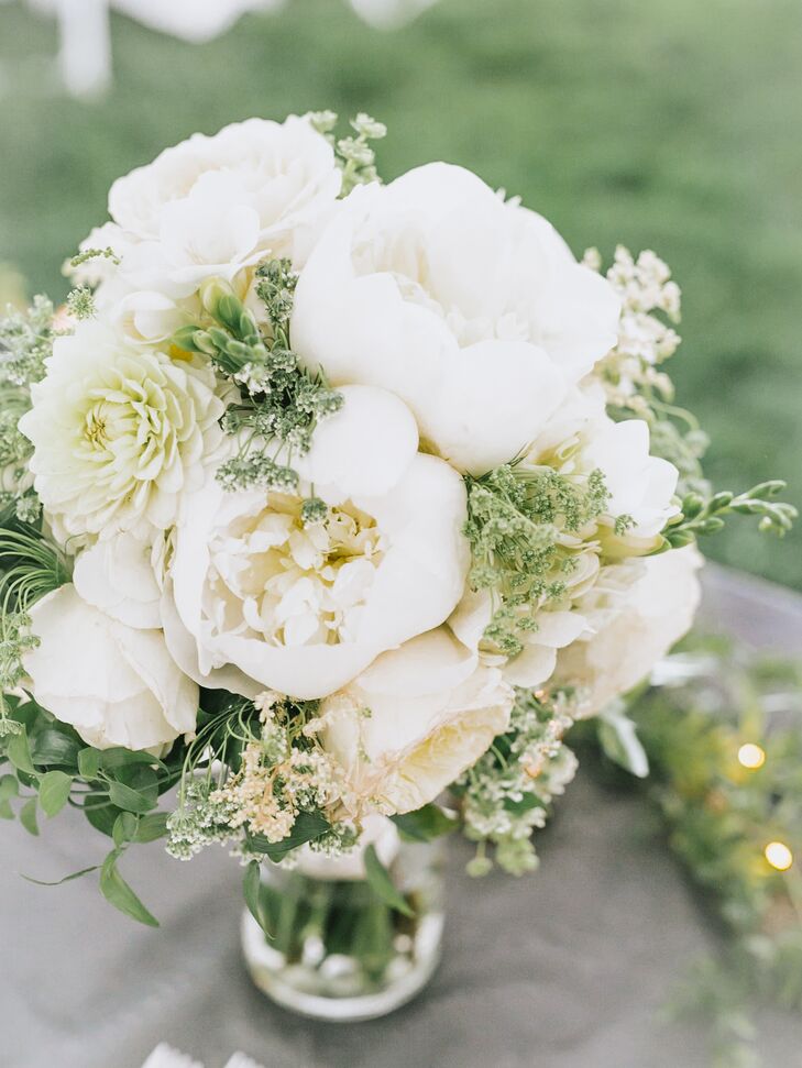 St. Ive's Florist designed the bridal and bridesmaid bouquets. "For my bouquet, I knew I had to have peonies, tulips and hydrangeas because those are my three favorite flowers," Kaasi says. "I did all white with greenery for the colors and the beauty."