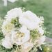 St. Ive's Florist designed the bridal and bridesmaid bouquets. "For my bouquet, I knew I had to have peonies, tulips and hydrangeas because those are my three favorite flowers," Kaasi says. "I did all white with greenery for the colors and the beauty."