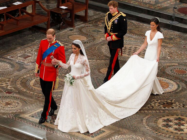 Kate Middleton walks with Pippa holding her trail.