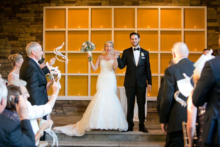 The couple was married outside at Stone House at Stirling Ridge in front of a warm orange backdrop accented with twinkling votives.