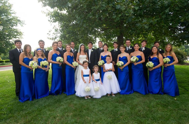 The bridesmaids matched in strapless cobalt blue gowns with green hydrangea bouquets.