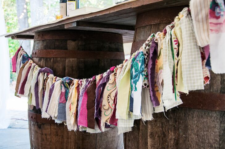 The mother of the bride made this tassel garland using strips of colorful fabric, which hung at the DIY-filled reception.