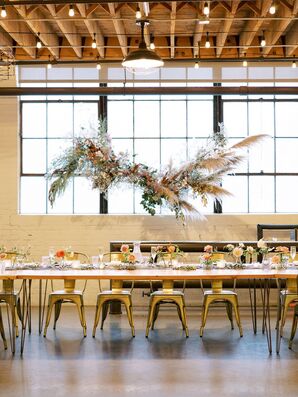 Hanging Pampas Grass Installation Over Table and Tolix Chairs