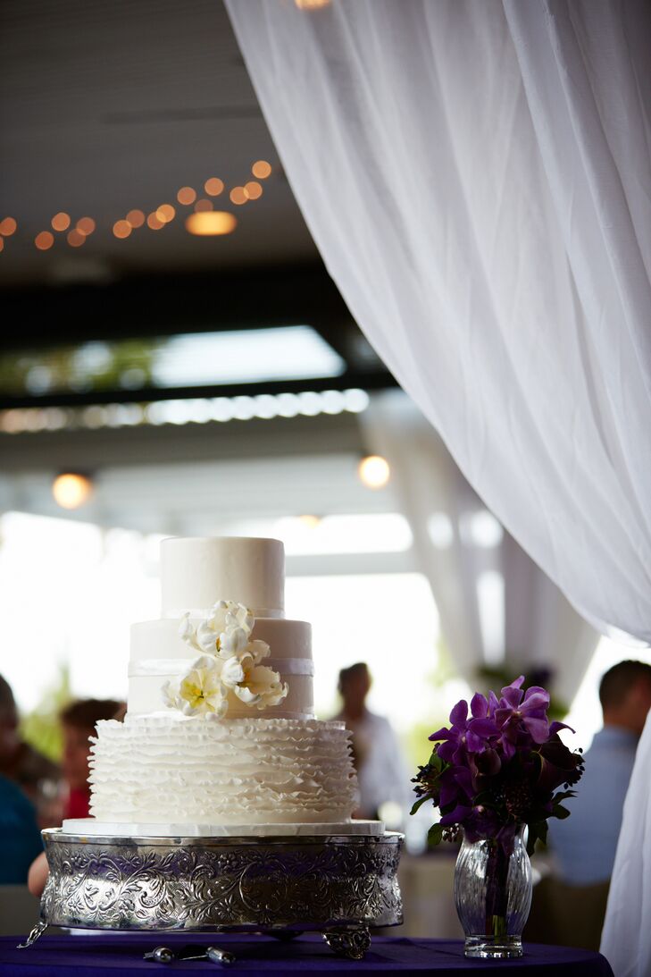 The bottom tier of Stephanie and Nathan's wedding cake consisted of a vanilla bean cake with strawberry filling. They chose a chocolate cake with chocolate buttercream for the middle tier while carrot cake with cream cheese icing filled the top tier.